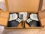 Moergo GLOVE80 Keyboard V1 Gray, Brown Switches Used. Price: $319.95.