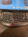 Adesso WKB-3150UB Wireless Ergonomic Keyboard With Built-in Removable Trackball Open. Price: $58.43.