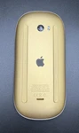 A1657 Apple Magic Mouse - Yellow / Gold Used. Price: $45.00.