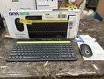 Onn Multi-device Wireless Full-size Keyboard And 3-BUTTON Mouse Set,gray &yellow Open. Price: $27.00.